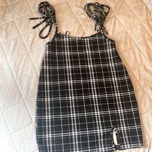 Short black and white plaid patterned dress. Size Medium. Brand is H&M.